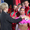Belarusian Deputy Sports Minister Zaburianova is awarding the Belarusian team that held the 7th place at the world championship of sports dancing. [Press for large view]